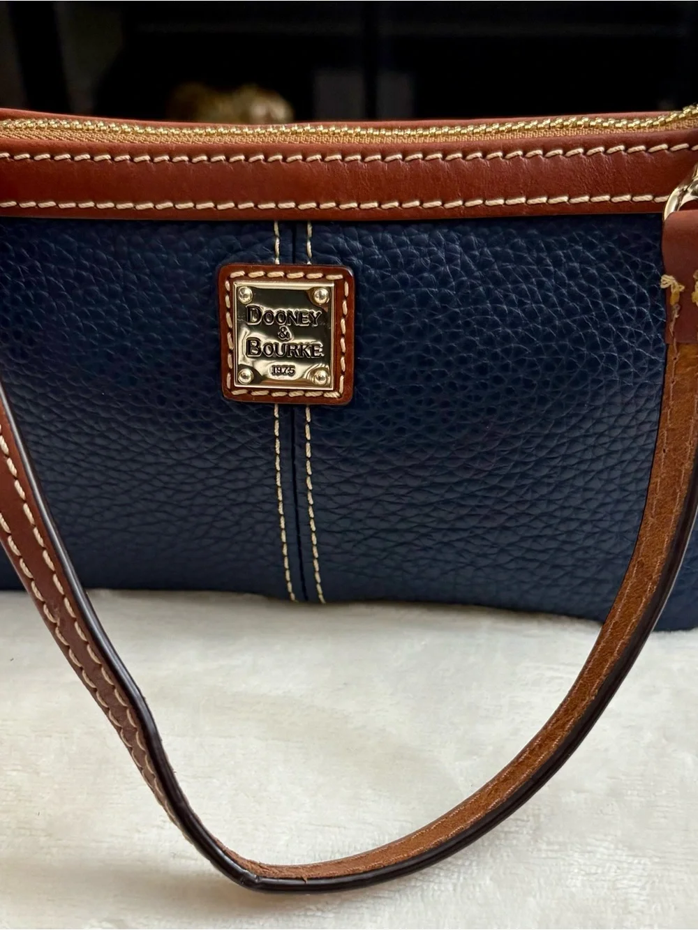 Dooney & Bourke Large Slim Cell Phone Wristlet – Navy Blue Pebble Grain Leather.